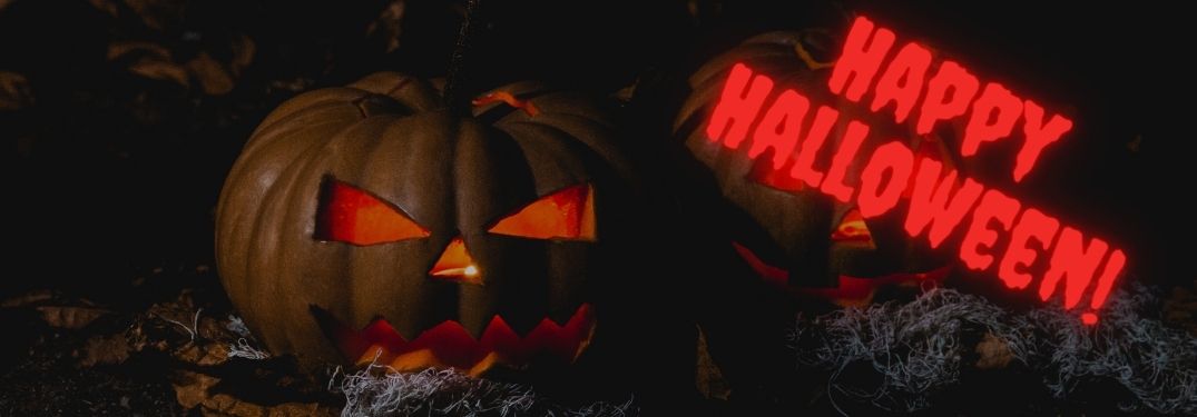 Lit Halloween Jack-o-Lanterns with Glowing Red Happy Halloween Text