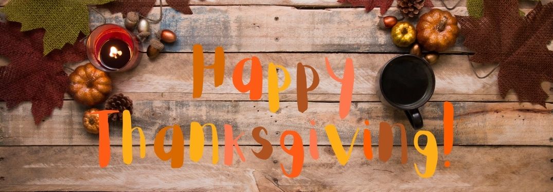 Wood Background with Fall Decorations and Fall-Colored Happy Thanksgiving Text