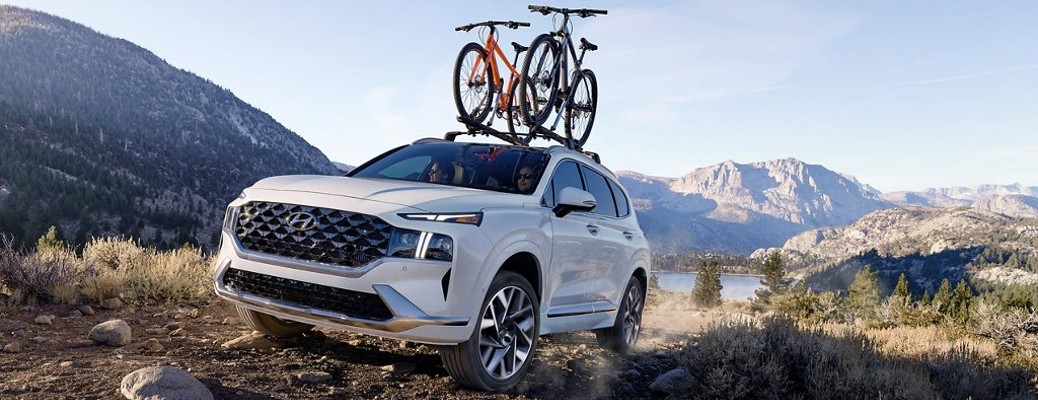 A 2022 Hyundai Palisade with bikes attached to the roof rack