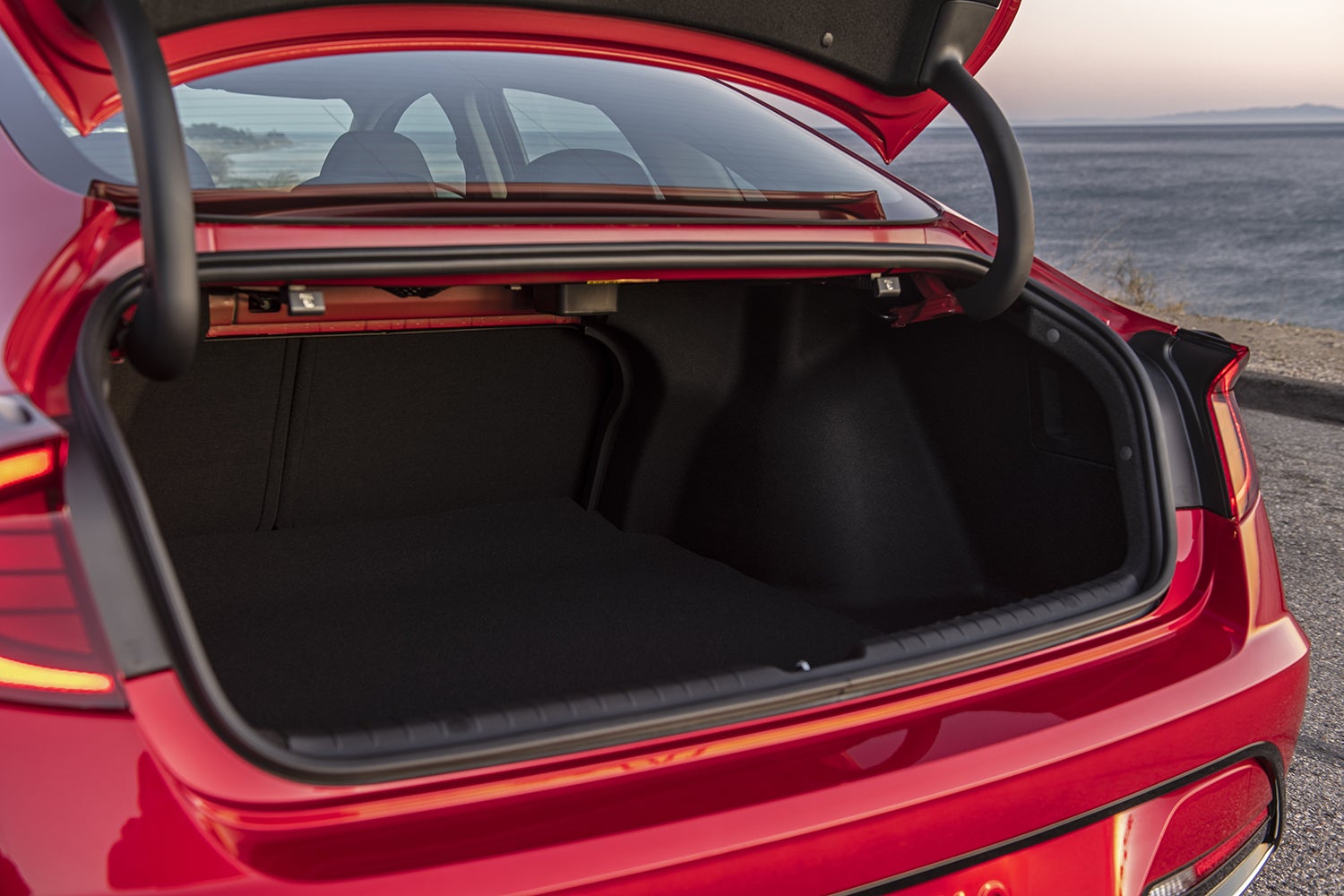 Spacious cargo area of a 2023 Hyundai Sonata Hybrid with a folding rear seat