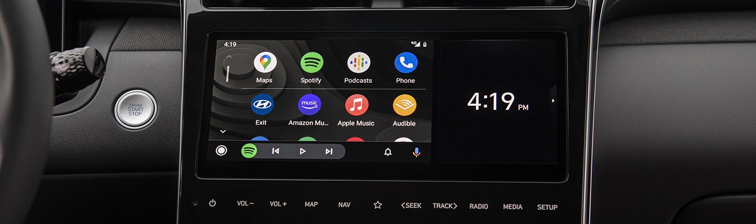 Spacious cargo area of a 2023 Hyundai Tucson Hybrid with a folding rear seat.